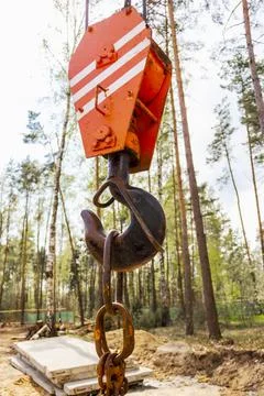 Crane hook for lifting loads. Lifting device for stacking cargo. Photos
