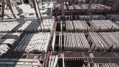 Crane hook moved above slabs on concrete factory Stock Footage 70207929