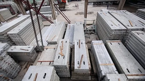 Crane hook moved above slabs on concrete factory Stock Footage 70207992