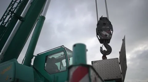 Crane hook raising up with chains Stock Footage 59768084