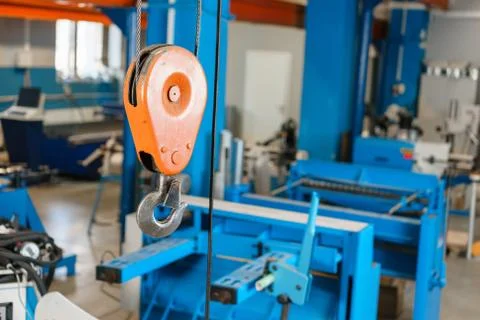 Crane hook. The system of pulleys and ropes, a hanging mechanism in the Stock Photos