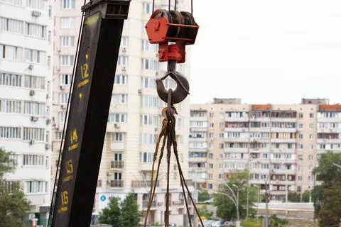 Crane hook. Tower Crane Hoist Rope against the blue sky and new building Stock Photos