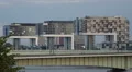 Crane Houses Modern Architecture Rush Hour Commuter Cars Traffic Crossing Bridge HD Footage