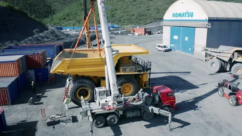 Crane installation of the body on the Komatsu 730e dump truck Stock Footage 221043448