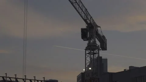 Crane with jet trail Stock Footage 148167787