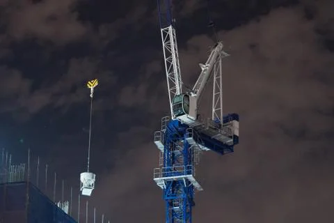 The crane to lift objects on top of the building. 스톡 사진