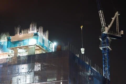 The crane to lift objects on top of the building. 스톡 사진
