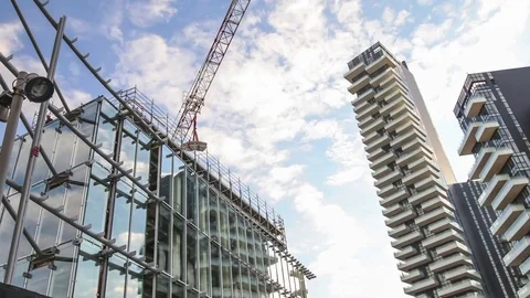 Crane lifting blocks on a modern building site in timelapse Stock Footage 72460579
