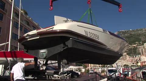 Crane lifting boat Stock Footage 32042480