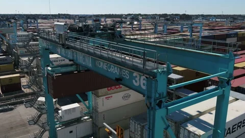 A crane lifting a cargo container Stock Footage 171588971