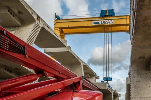 Crane lifting a concrete element at the construction site of Princess Mary Br Stock Photos
