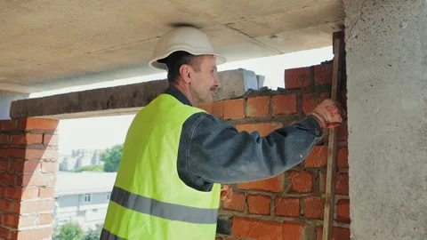 Crane Lifting Concrete Slab at Construction Site, A crane is lifting a concrete Stock Footage 281182151