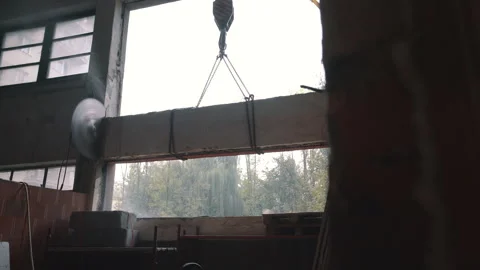 Crane Lifting Cut Concrete Panel. Construction and Heavy Lifting Stock Footage 288196502