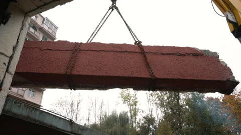 Crane Lifting Cut Concrete Panel. Construction and Heavy Lifting Stock Footage 288197716
