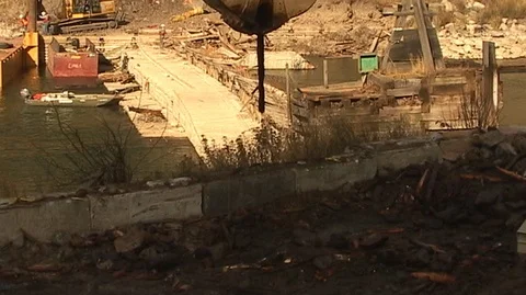 Crane Lifting Dam Debris Stock Footage 93824612