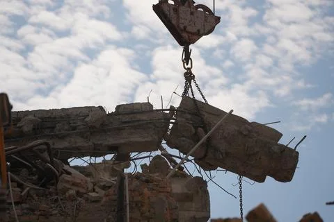 Crane lifting of a destroyed concrete structure Stock Photos