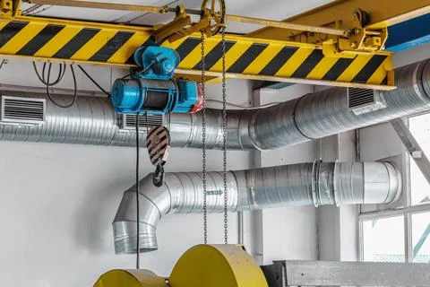 A crane is lifting a heavy object Stock-Fotos