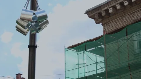 Crane lifting metal construction materials near building under renovation Stock Footage 341833898