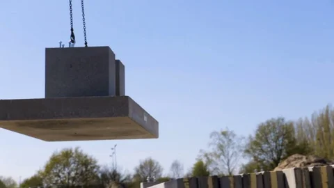 Crane lifting a piece of concrete. Stock Footage 70051322