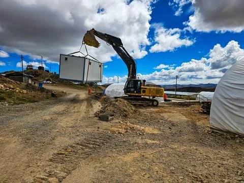 Crane lifting process in constructions Stock Photos