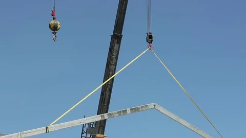 Crane lifting rafter Stock Footage 77048582