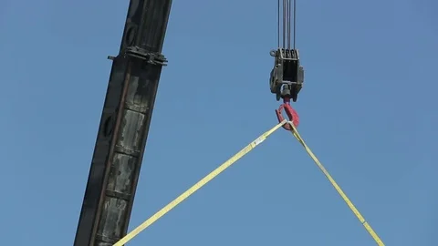 Crane lifting rafter Stock Footage 77099873