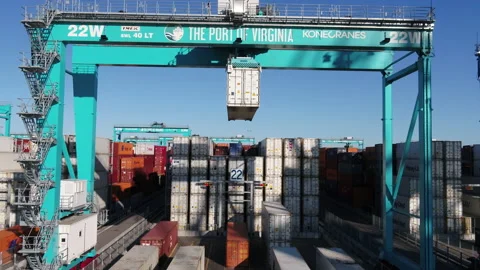 A crane lifting a refrigerated shipping container Stock Footage 171590143