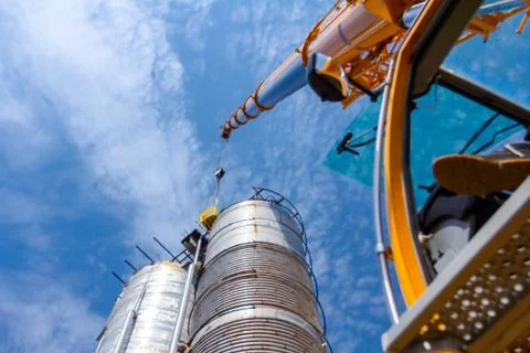 Crane is lifting work basket Stock Photos