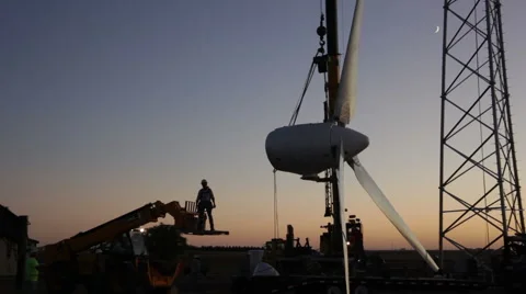 Crane lifting worker, technician to the head of a wind turbine Stock Footage