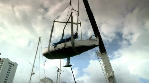 Crane lifting a yacht Stock Footage 710774