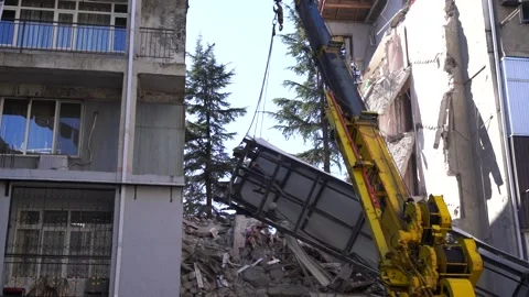 Crane lifts the elevator of a destroyed ... | Stock Video | Pond5