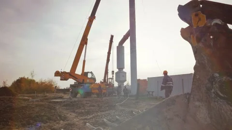 The crane lifts a huge pipe Stock Footage 142498344