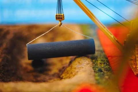 The crane lifts the iron Stock Photos