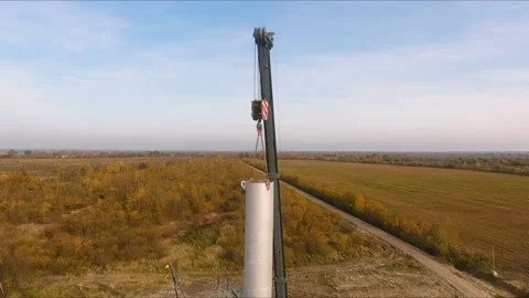 The crane lifts a large pipe, vertical aerial view Stock Footage 142494198
