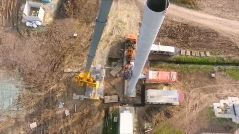 The crane lifts a large pipe, vertical aerial view Video stock 142494308