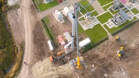 The crane lifts a large pipe, vertical aerial view Stock Footage 142494360