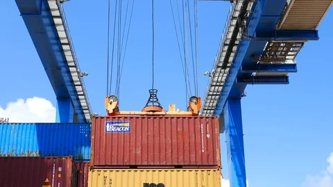 A crane lifts a yellow cargo container 4k intro outro for business  Stock Footage 92139691