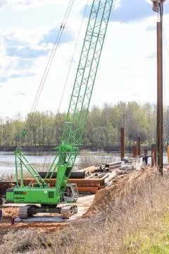 Crane with a load on the boom. Photos