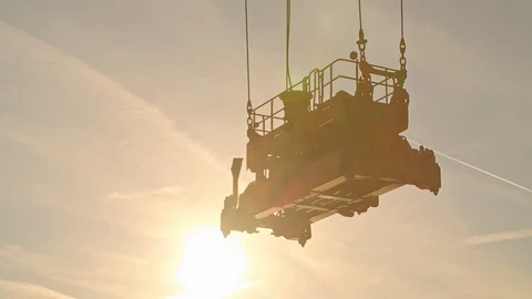 Crane load Container to a Huge Ship at Sunset Видео 120554379