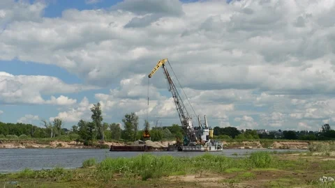 A crane loads a barge with sand 스톡 동영상 142095446