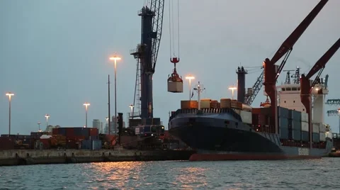 Crane Loads Cargo on Ship at Port Stock Footage 49361956
