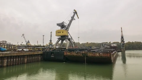 The crane loads the hatches on the barge. Stock Footage 86788533