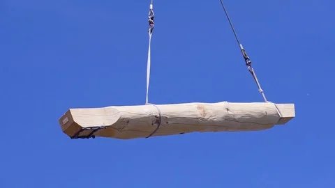 Crane with log on background of sky. Clip. Log is moved with crane on Stock Footage 116903465