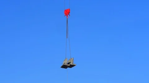 Crane lowering concrete section into place on building site in leeds uk Stock Footage 90374371