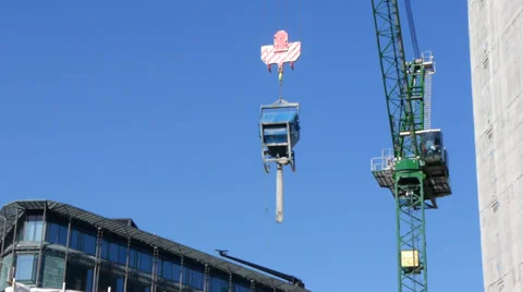 Crane lowering a container on a building site Stock Footage 37257341