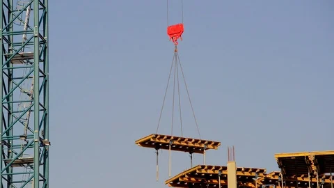 Crane lowering floor section into place on building site in leeds uk Stock Footage 90427767