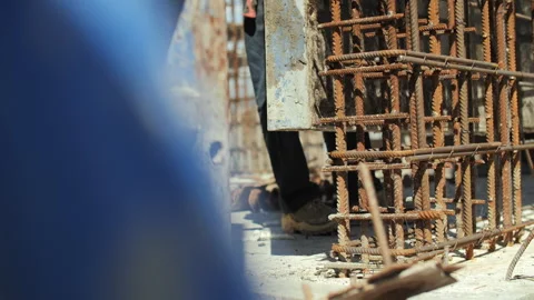 Crane lowering formwork around steel reinforcement Video stock 314645138