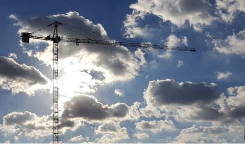Crane (machine) over a blue sky Stock Photos
