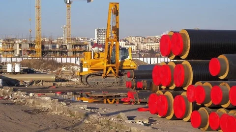 Crane machine work in sunny day against blue sky Stockbeeldmateriaal 84025284