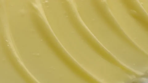 Crane macro texture of yellow face cream with mango butter Video stock 232889599